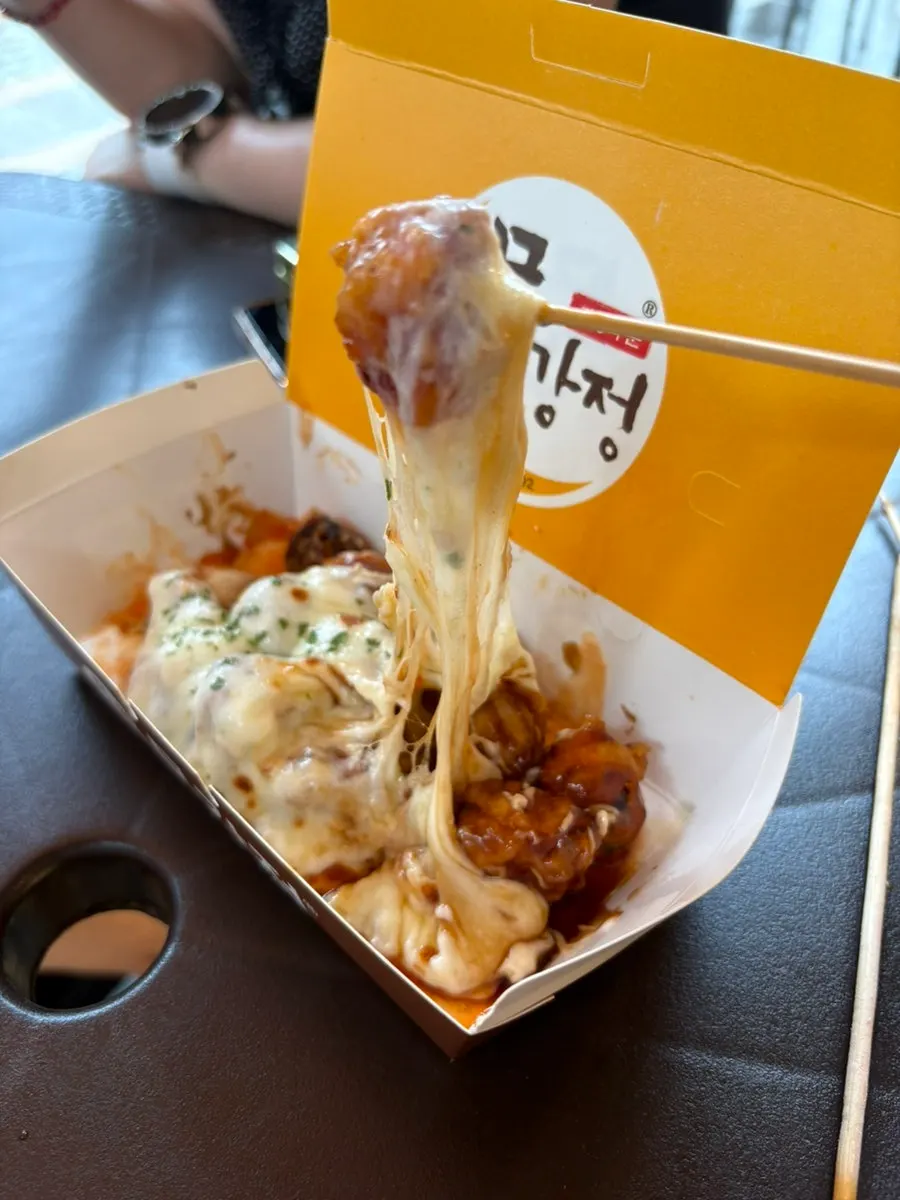 Close-up of mungangjeong covered in charred cheese