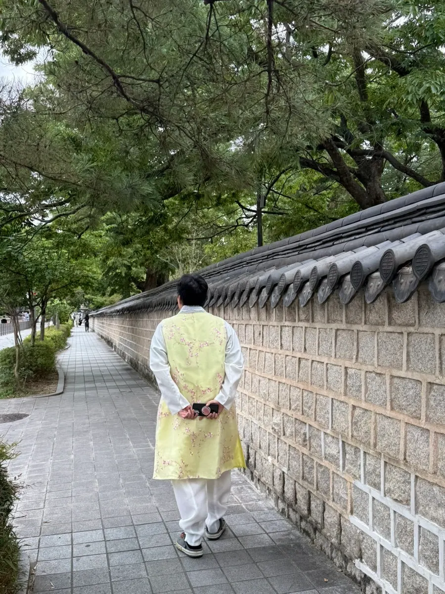 Pale yellow hanbok styled like a young noblewoman