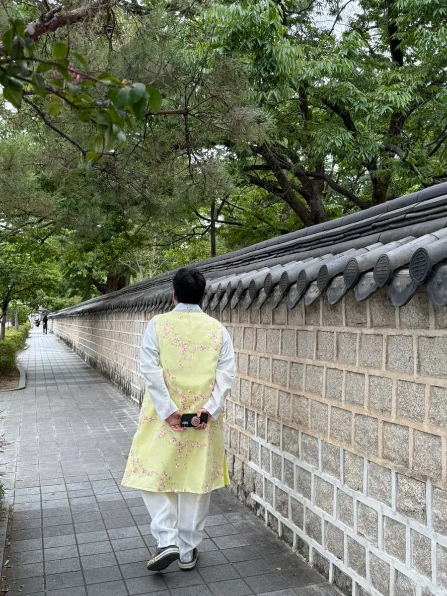Pale yellow hanbok with hair styling