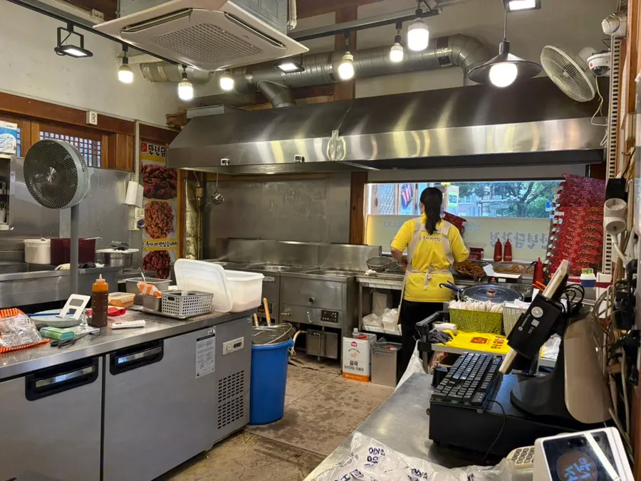 Open kitchen visible from inside the shop