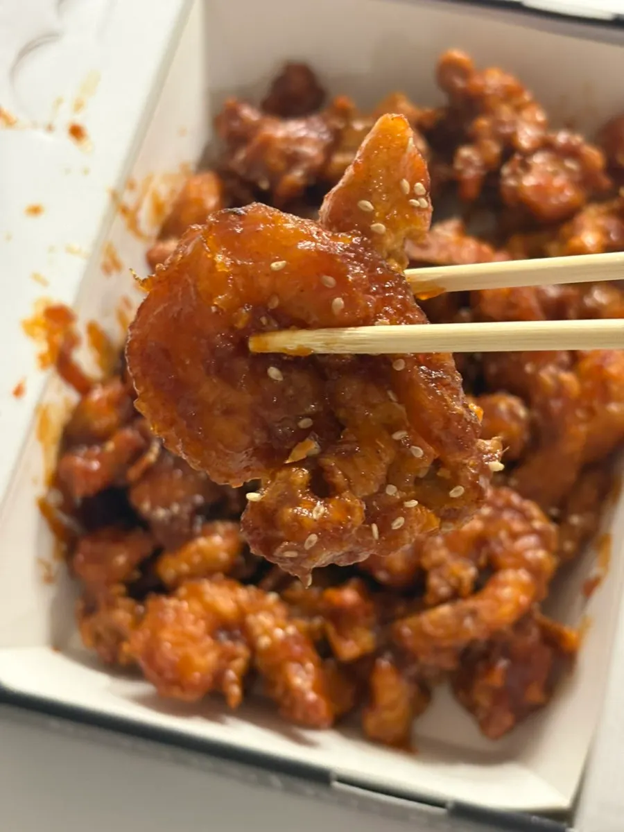 A single piece of seasoned boneless dakgangjeong