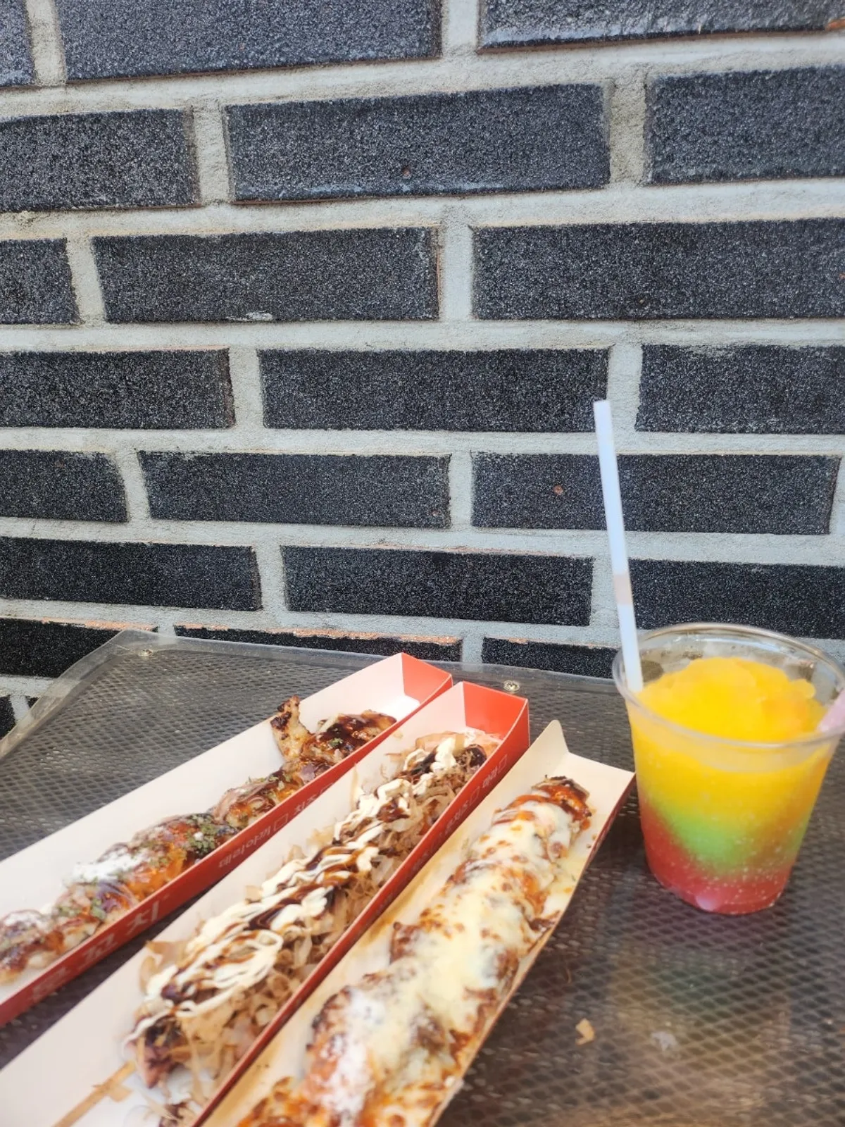 Three types of octopus and chicken skewers on the table