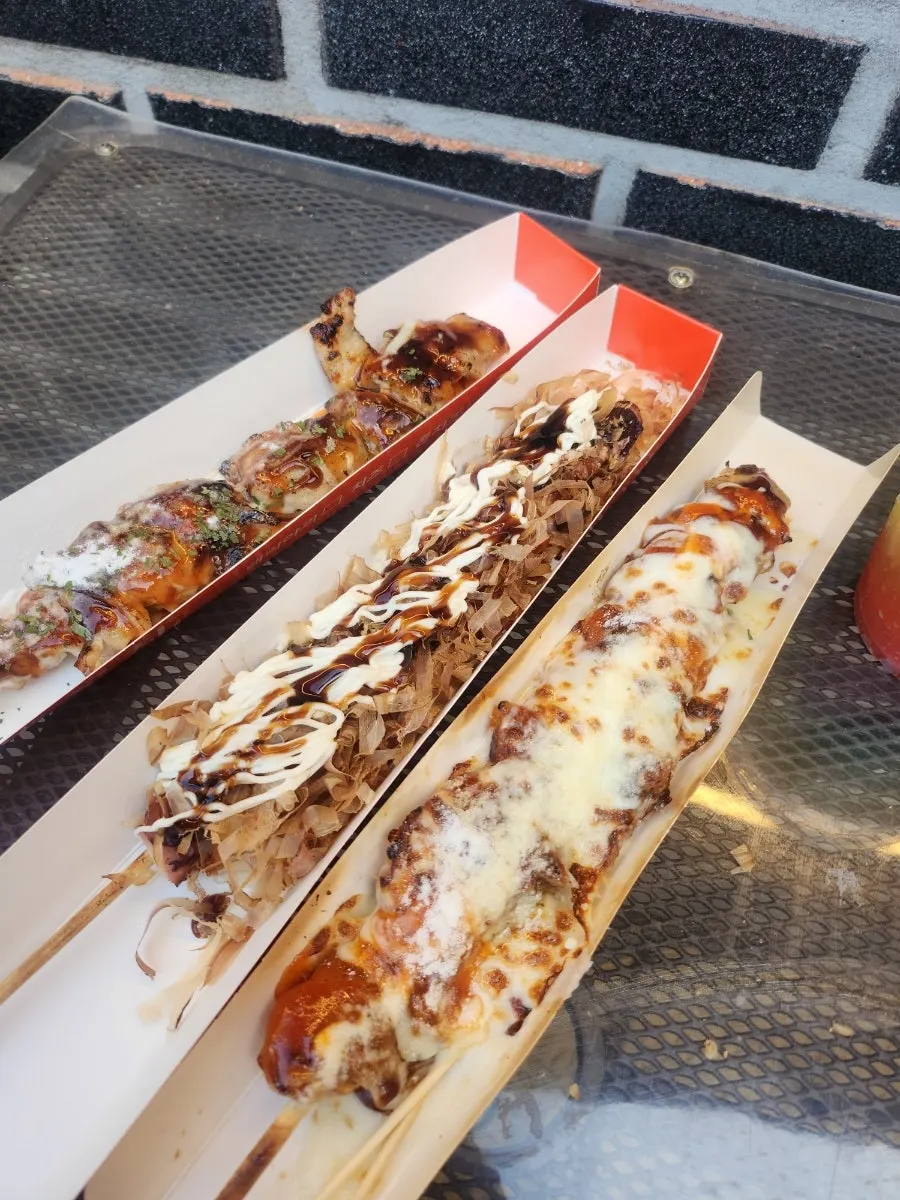 Cheese-topped chicken skewer and octopus skewer