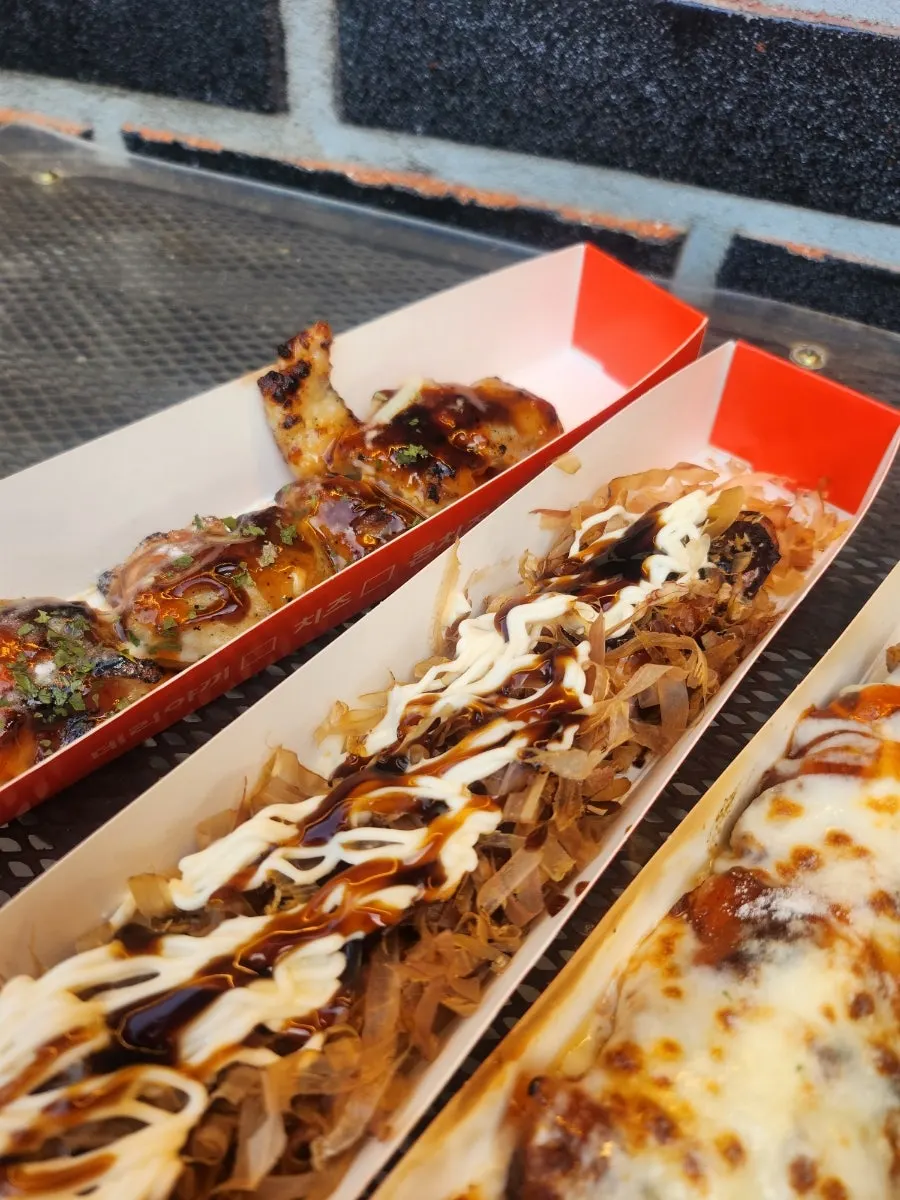 Octopus skewer topped with katsuo-bushi