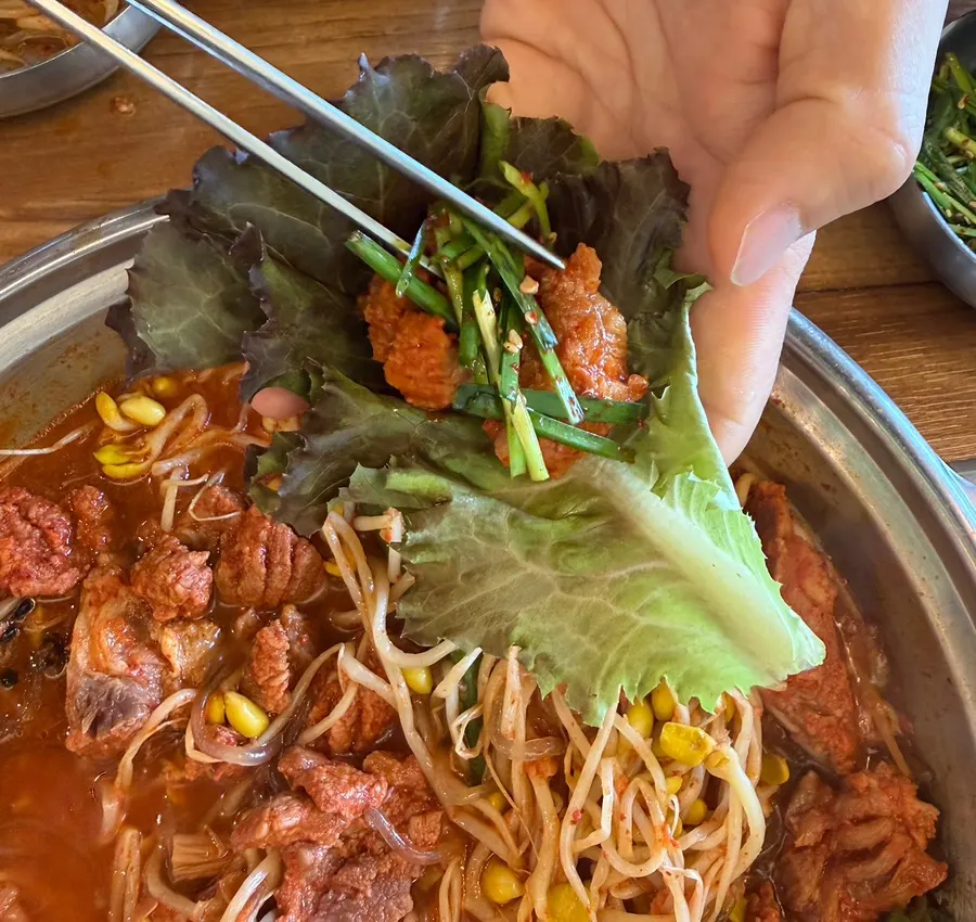 Mulgalbi galbi meat enjoyed in a lettuce wrap