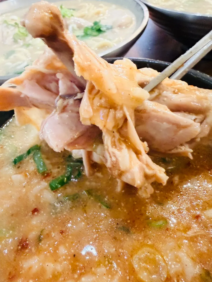 Stone pot of spicy chicken gomtang served with rice mixed in