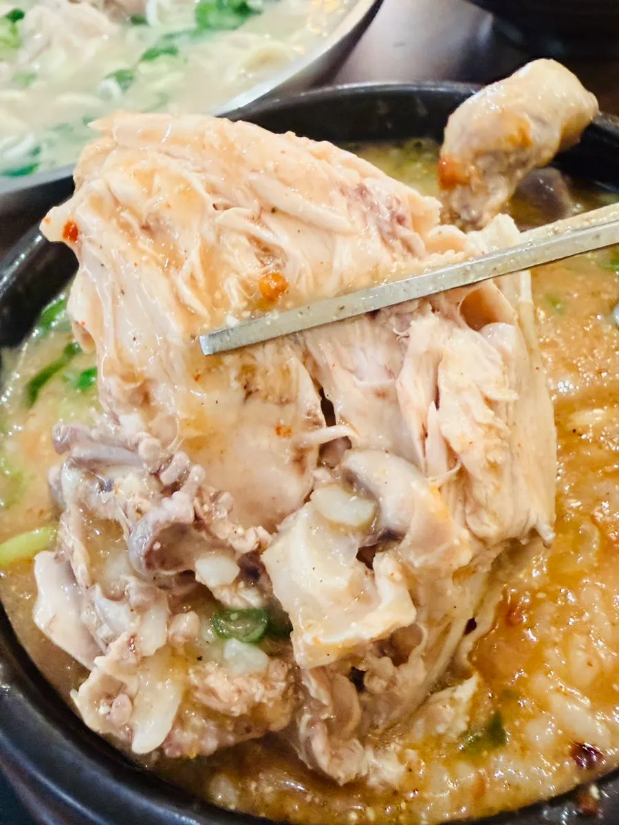 Chicken and rice inside the spicy chicken gomtang