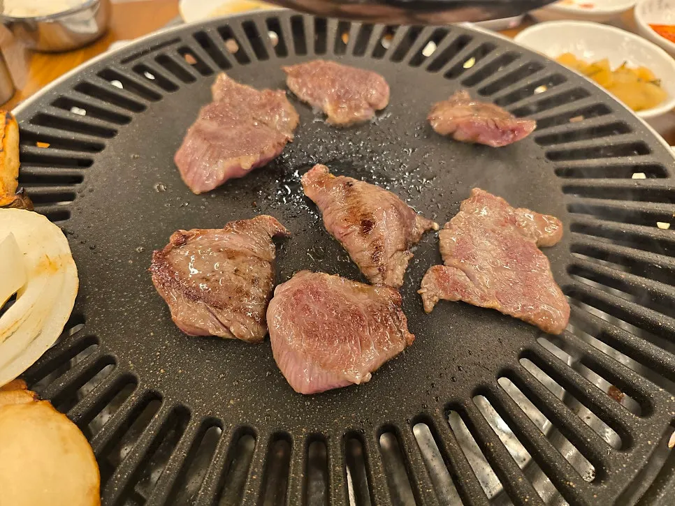 Fat layer of salchisal cooking on the grill