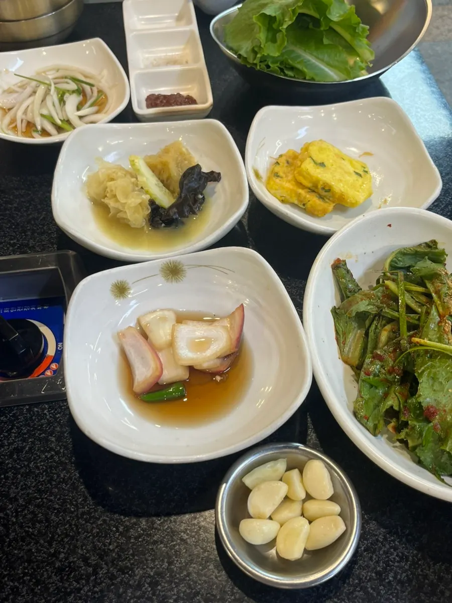 A full spread of basic side dishes at Jeonju House