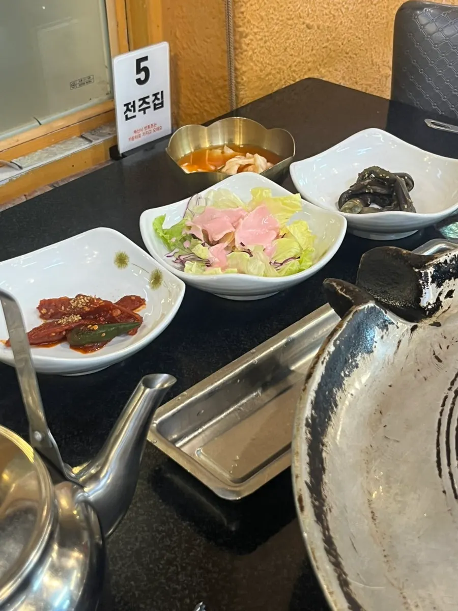 Plate of side dishes including pickled onion