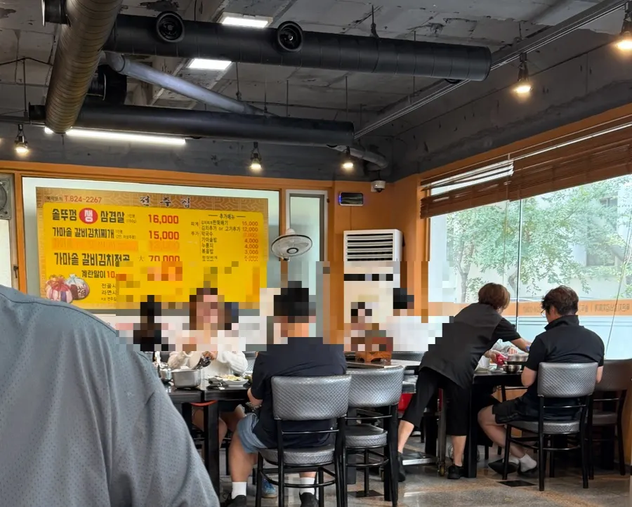 Restaurant interior with wooden decorations and Chinese character frames