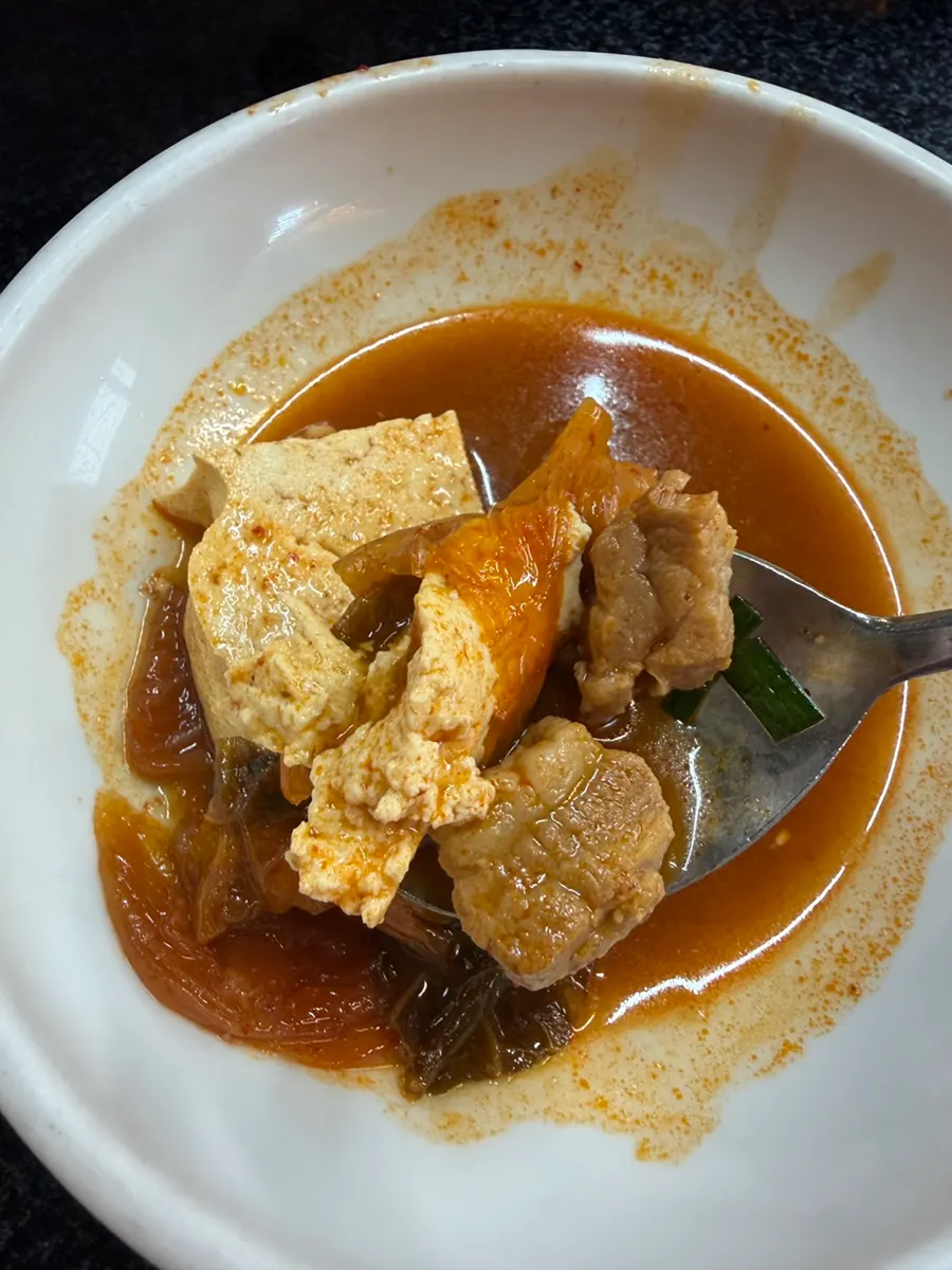 A bubbling pot of kimchi stew