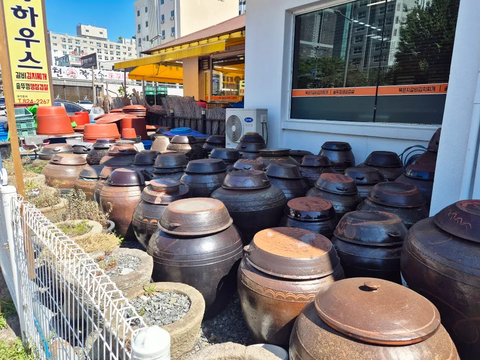 Row of jangdokdae crocks lined up outside the restaurant