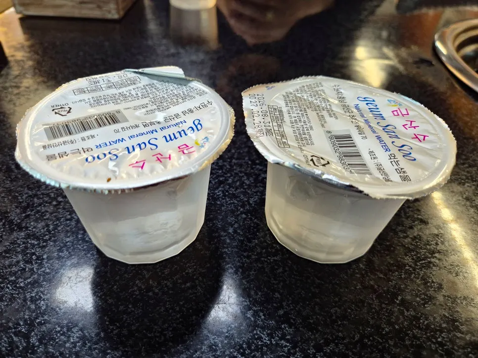 Individually packaged bottled water served instead of a water pitcher
