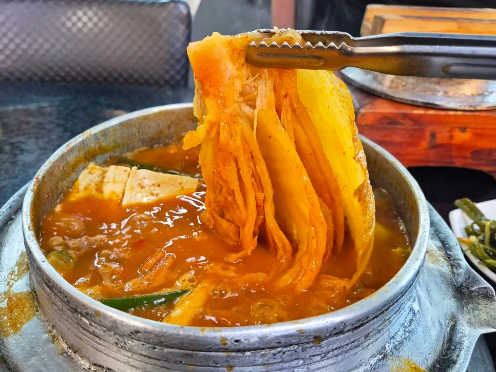 Stew filled with big chunks of whole-leaf kimchi and short ribs