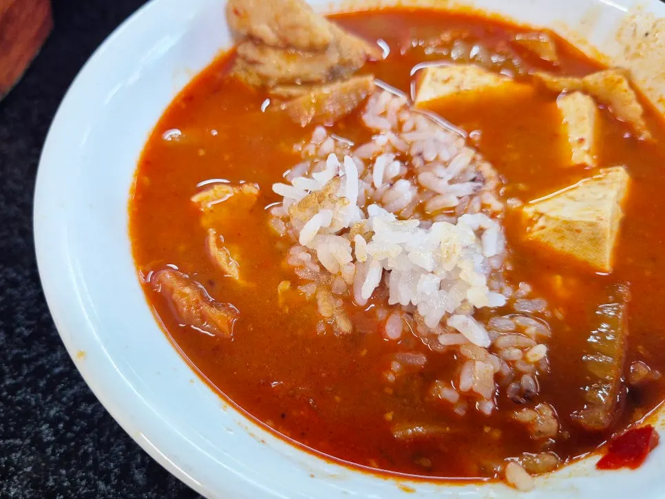 A piece of short rib scooped out along with the broth
