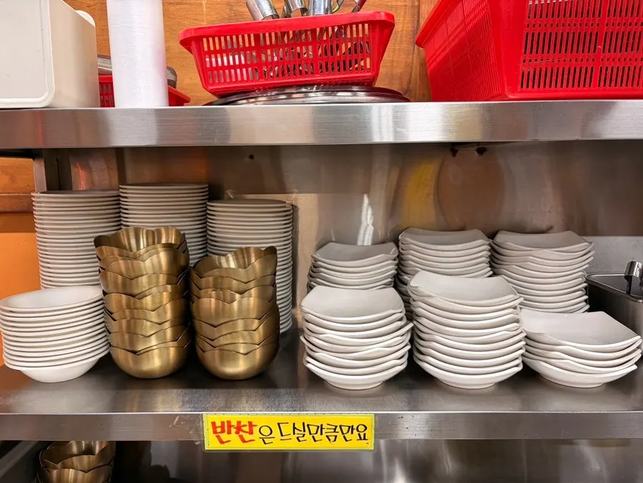 Side dish containers set out at the self-serve corner