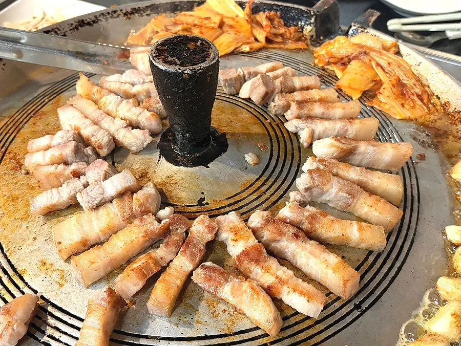 Pork belly grilled golden after adjusting the flame