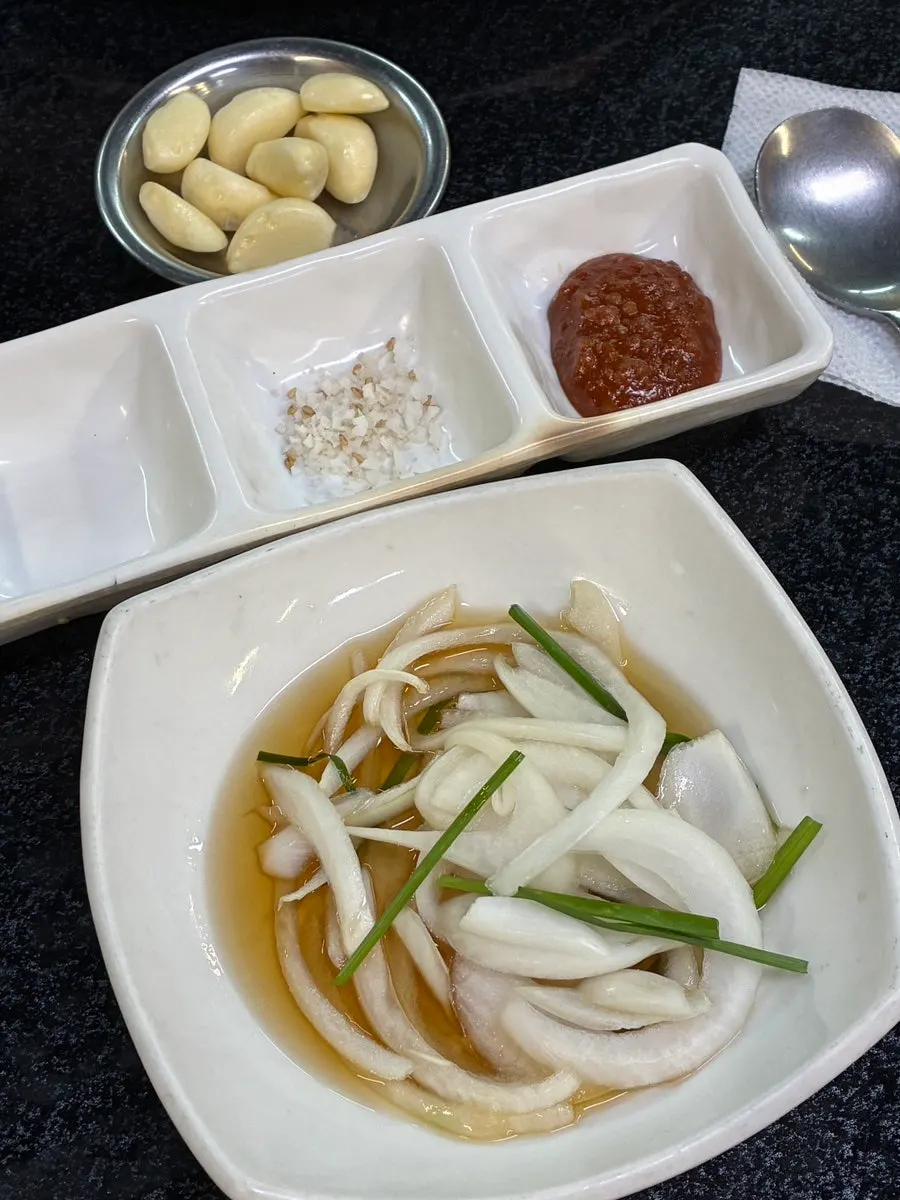 Table filled with several side dish plates