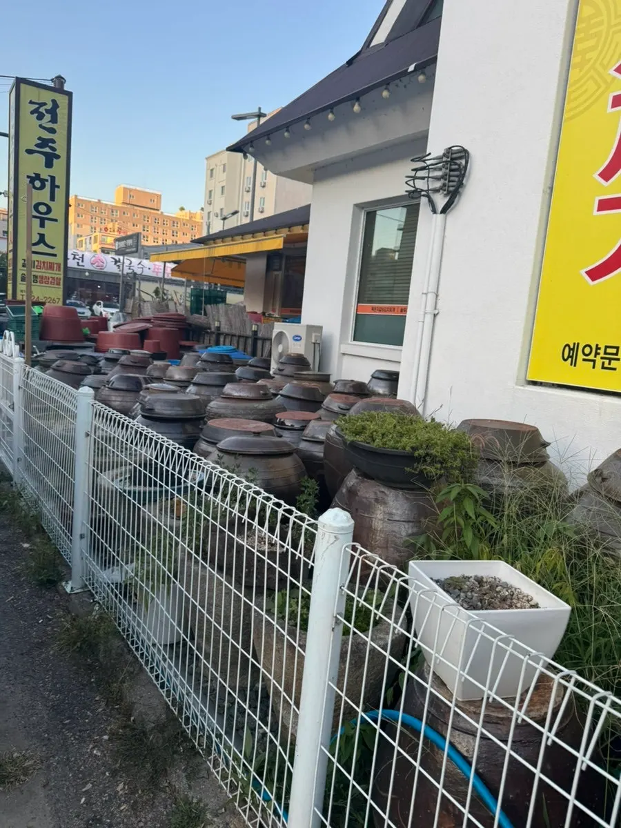 Entrance view of Jeonju House with onggi jars lined up