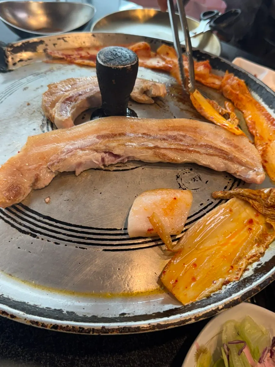 Aged kimchi served alongside the pork belly