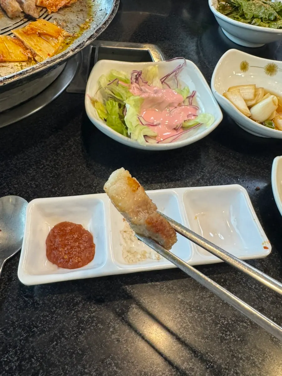 A plate combining aged kimchi and pork belly