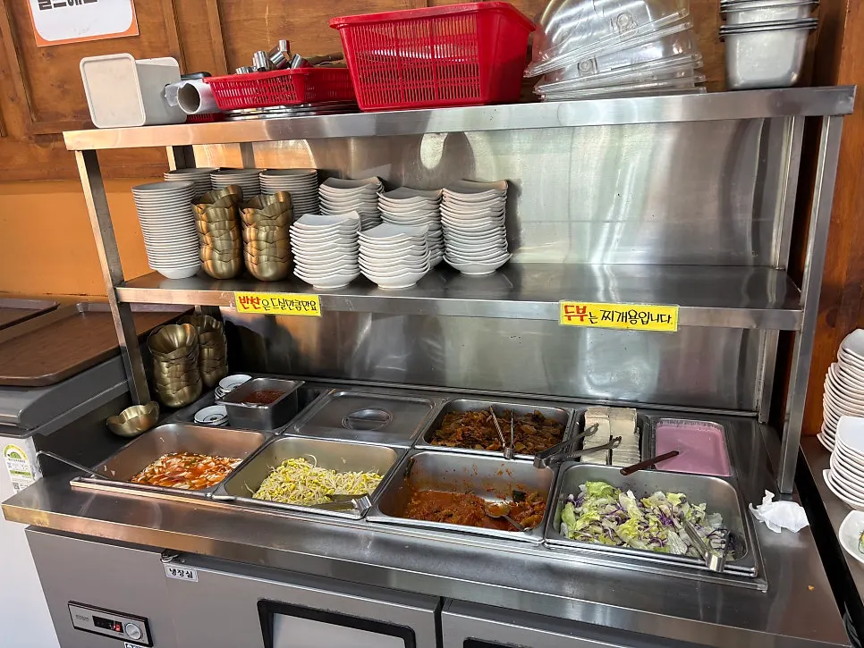 Self-serve bar at Jeonju House with side dishes and tofu