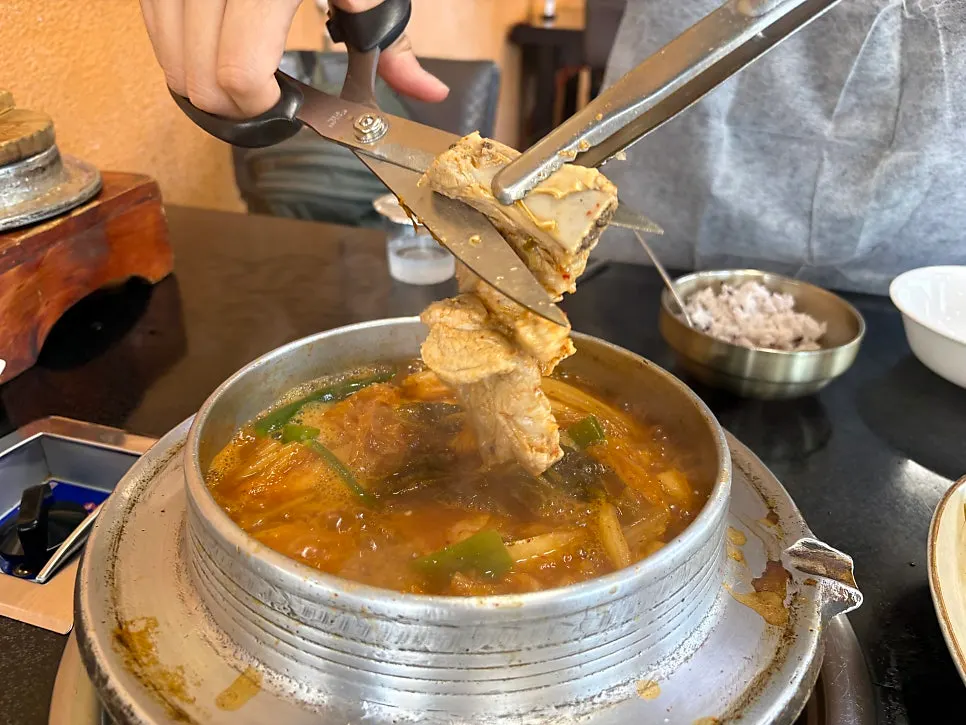 Galbi rib pieces inside the kimchi stew