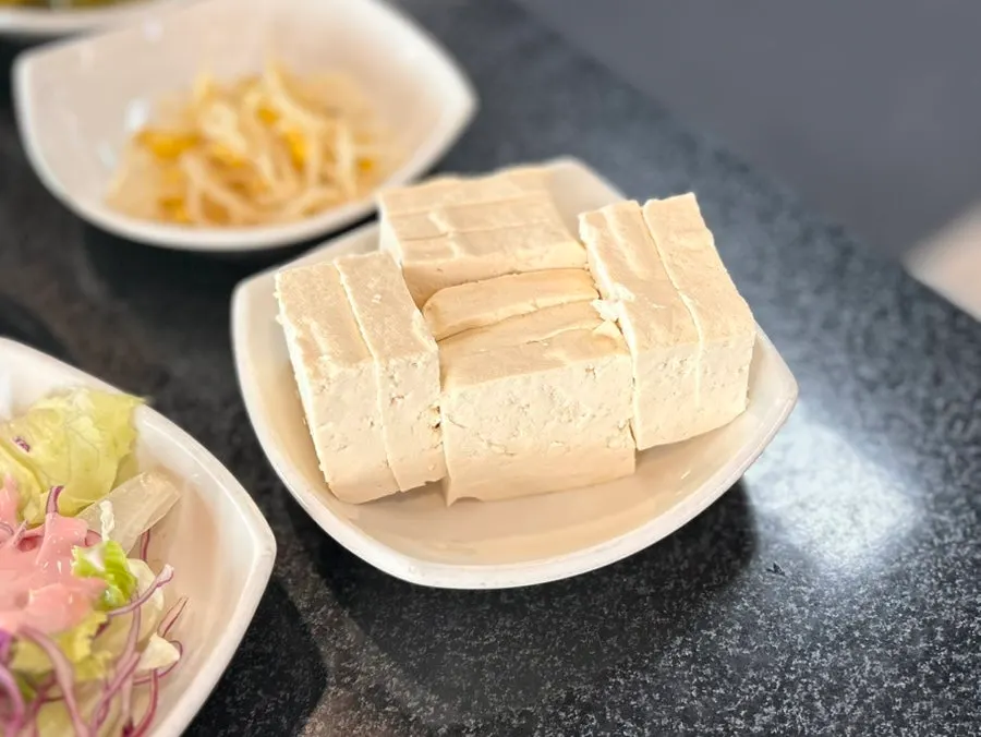 Side dishes and tofu at the self-serve bar