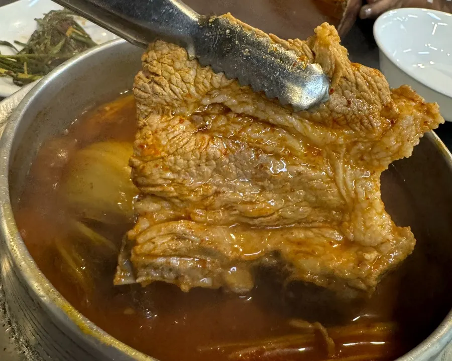 Whole short ribs in the galbi kimchi stew