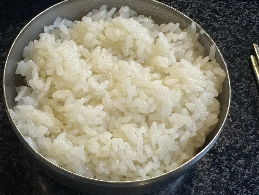 Glossy pot rice scooped into a separate bowl