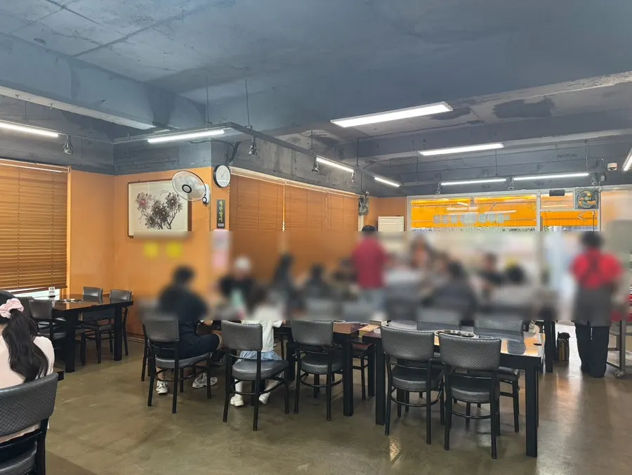 Interior of Jeonju House with wide table spacing