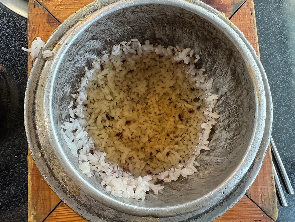 Rice crust forming in the pot after rice is scooped out
