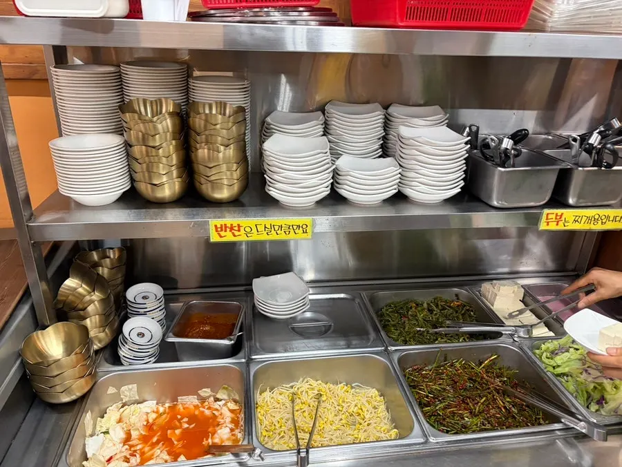 Self-serve corner with side dishes at Jeonju House