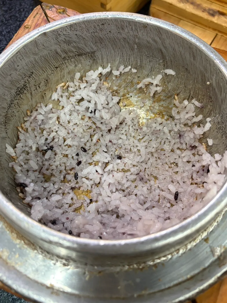 A glossy spoonful of pot rice