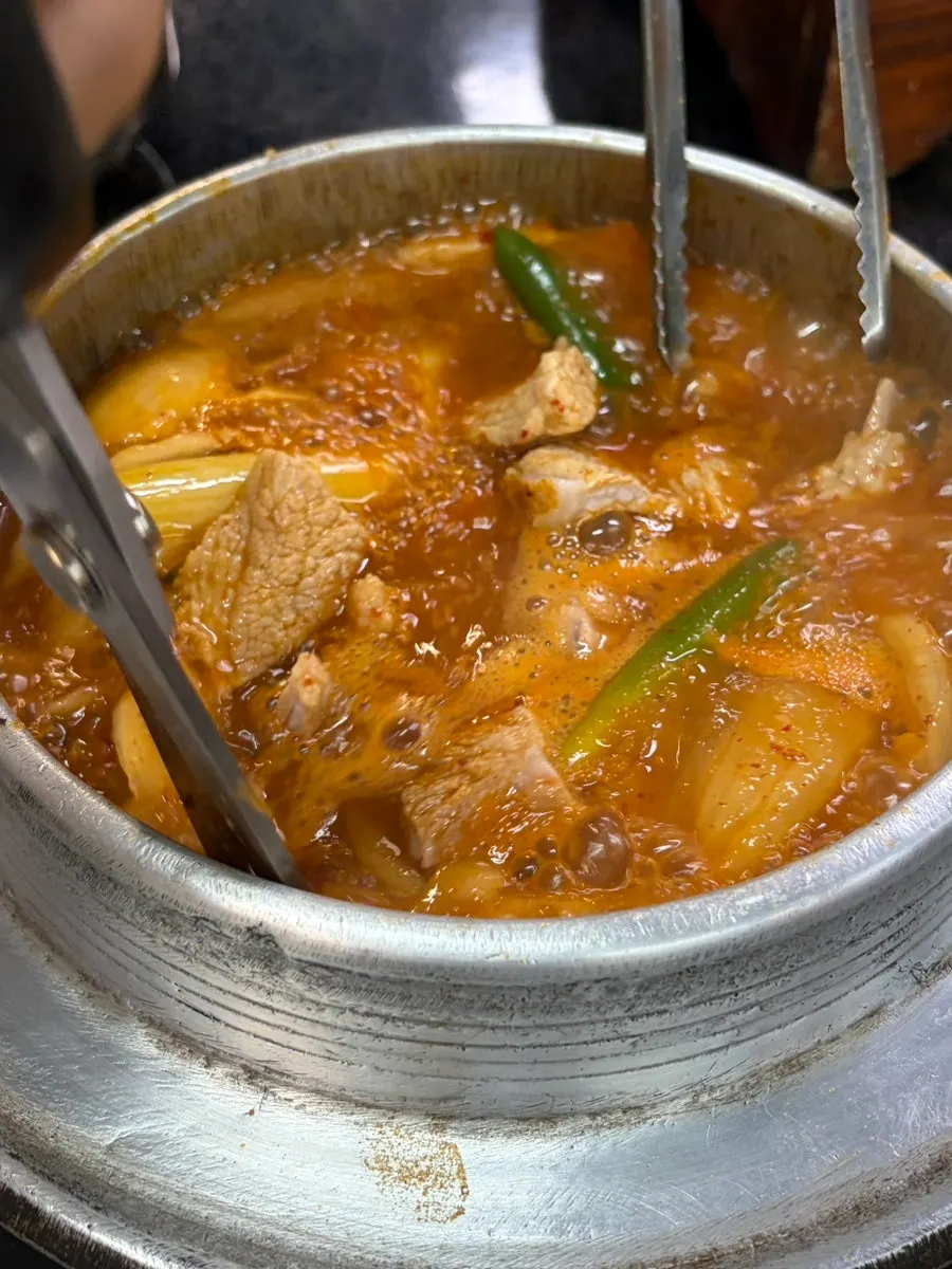 A chunk of galbi inside the stew