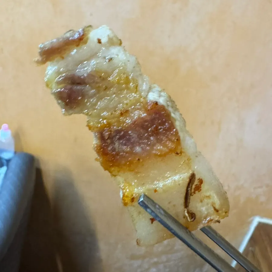 An extra serving of fresh pork belly ordered mid-meal