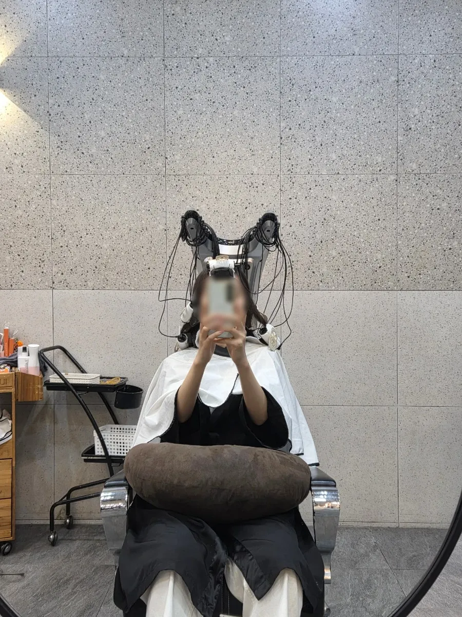 Designer applying the perm solution