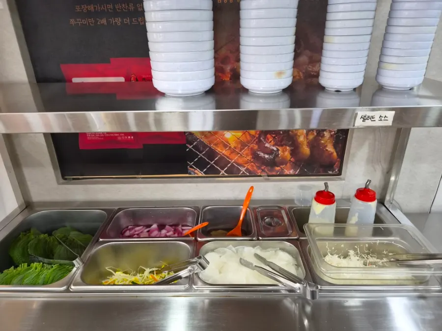 Menu board and price list at Jjukkumi Sinhwa