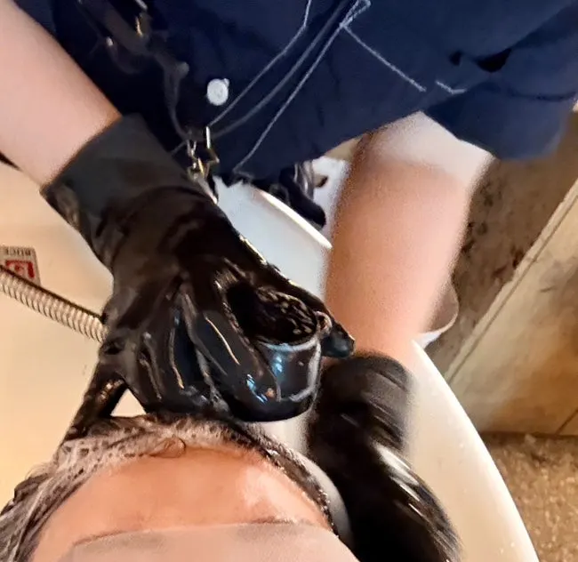 Getting a scalp massage in the shampoo room
