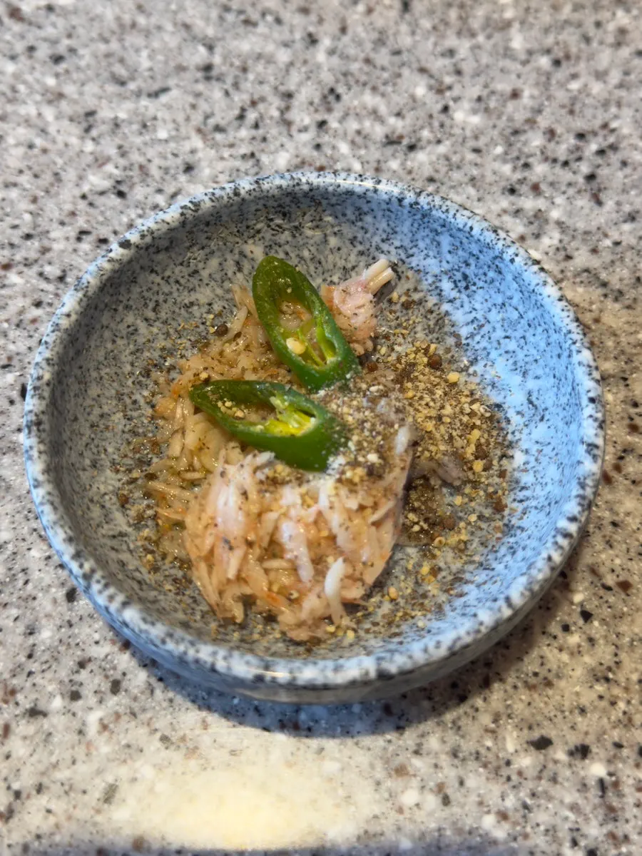Grilled deodeok root and white kimchi side dishes