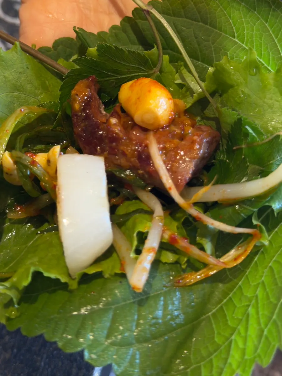 Grilled pork eaten with sauces