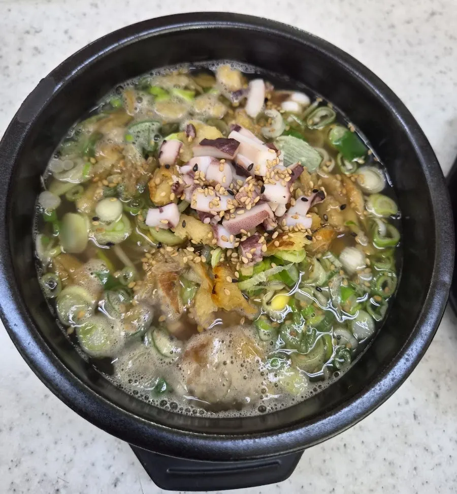 Royal bean sprout soup bubbling in a stone pot