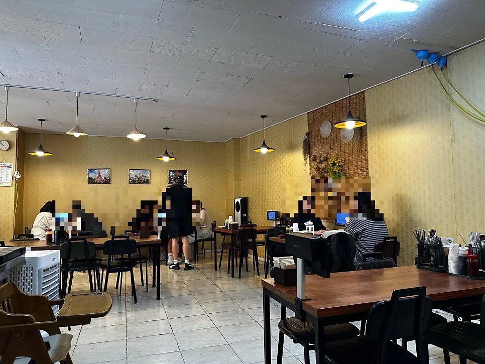 Interior of Phodam Jeonju City Hall Branch busy with morning customers