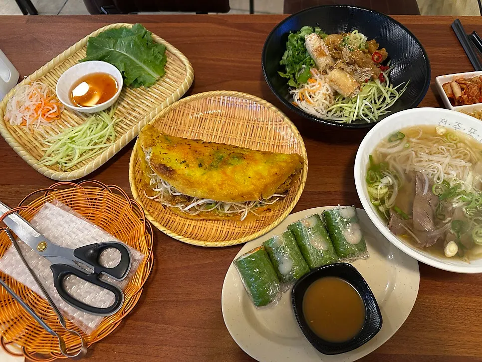 Four Vietnamese dishes served together at Phodam