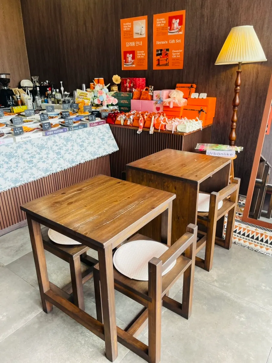 Store interior with wood-tone tables and soft lighting