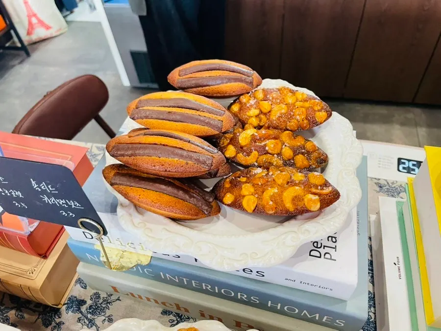 Display case with sweet corn and candied sweet potato financiers