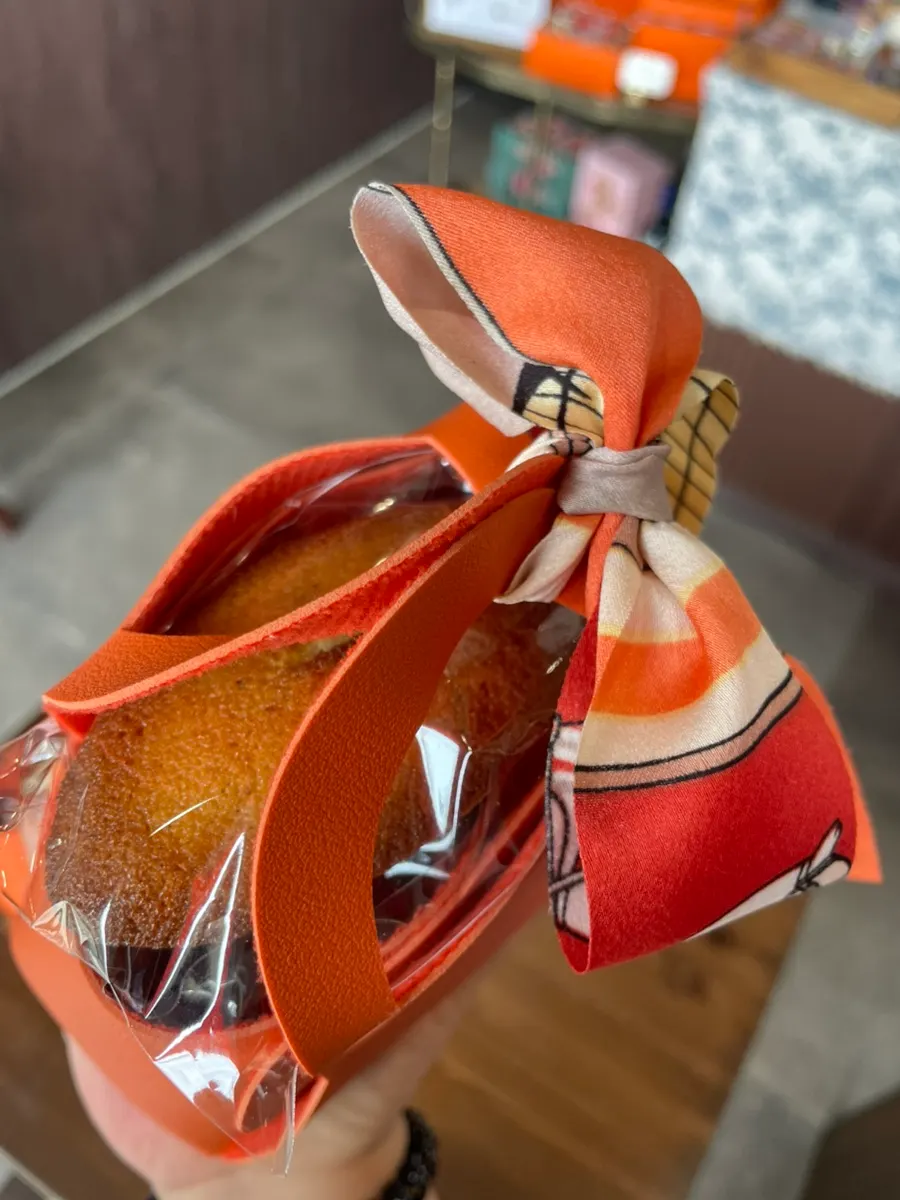 Several orange mini bag favor sets on display