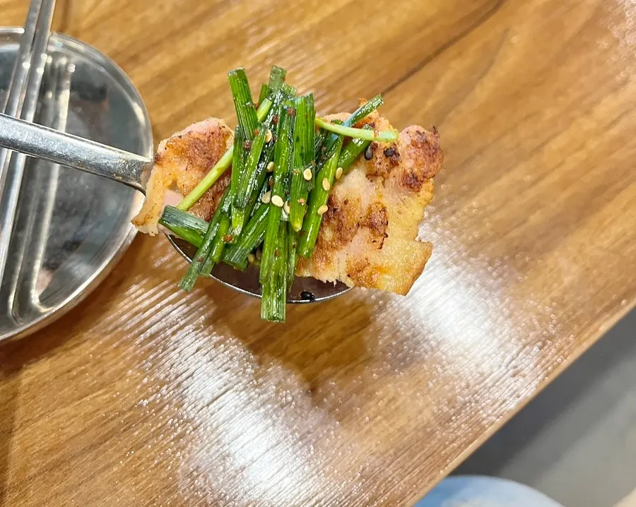 Yukjeon served with chives