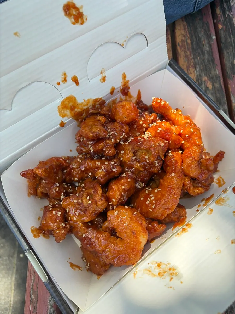 Hot dakgangjeong served with the lid open